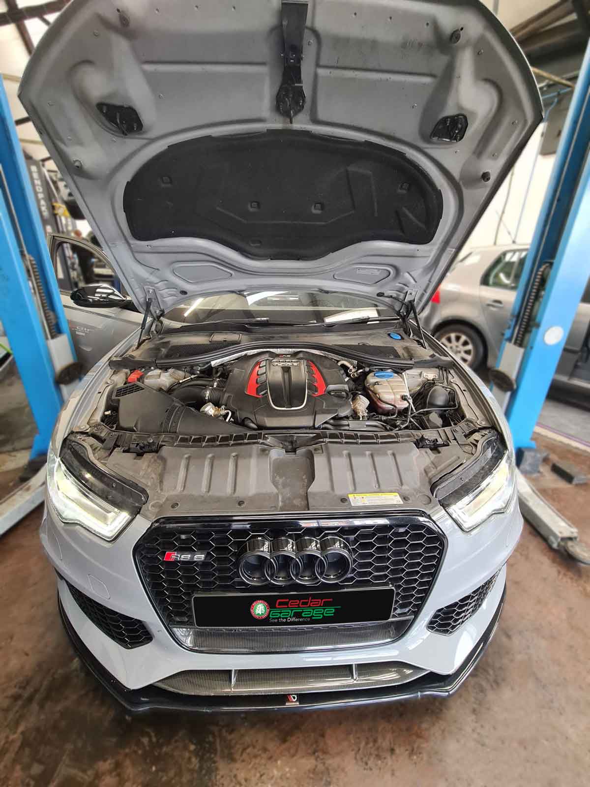 Audi RS6 on a ramp at Cedar Garage's Audi specialist workshop in Sompting