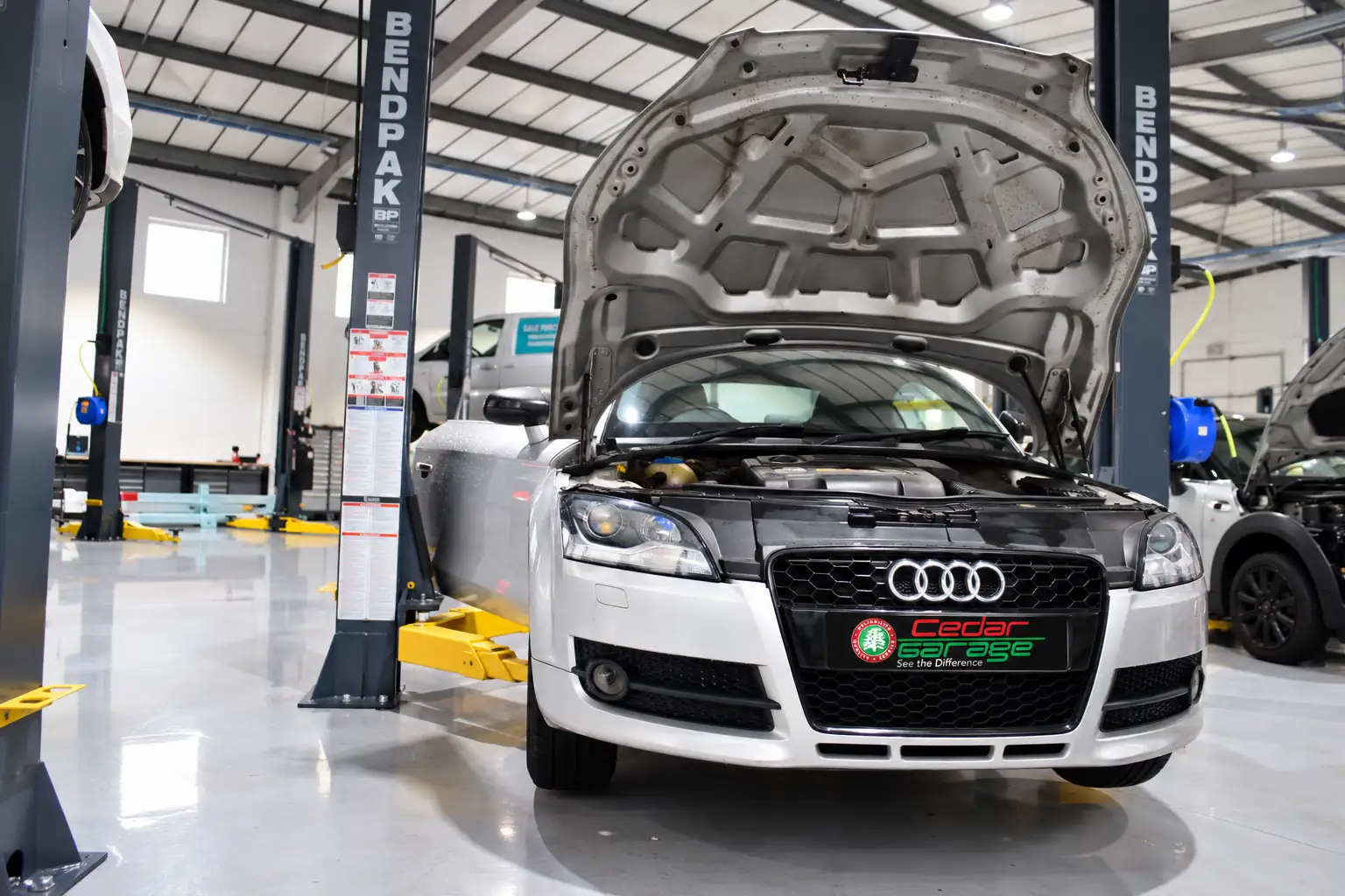 Audi raised on a lift in the Cedar Garage workshop for an underbody inspection