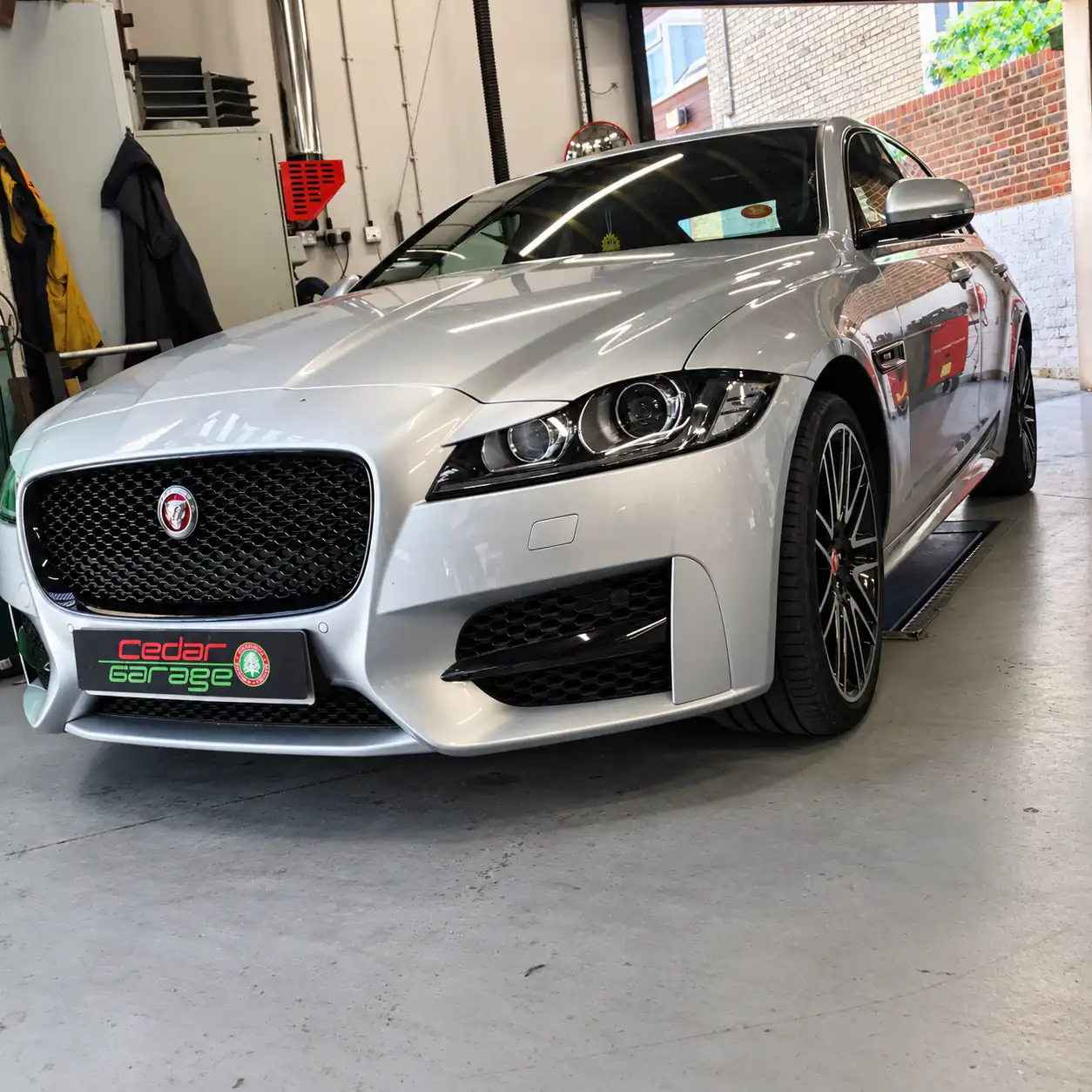 Jaguar Specialists at Cedar Garage Silver Jaguar saloon in the workshop at Cedar Garage, Worthing