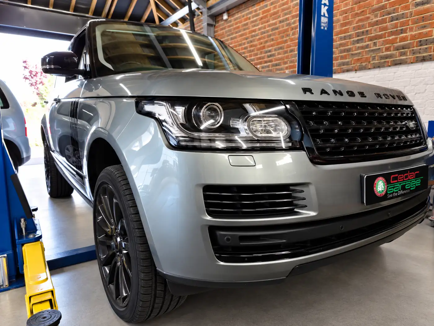 Range Rover Servicing at Cedar Garage Silver Range Rover on the ramp at Cedar Garage, Worthing