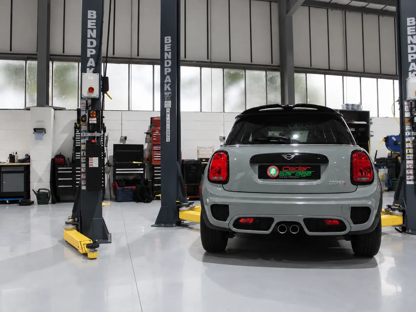 Mini Cooper on the ramp for its MOT at Cedar Garage