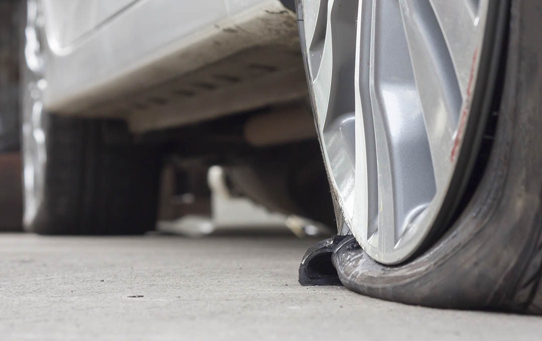 Pothole damage to a car wheel