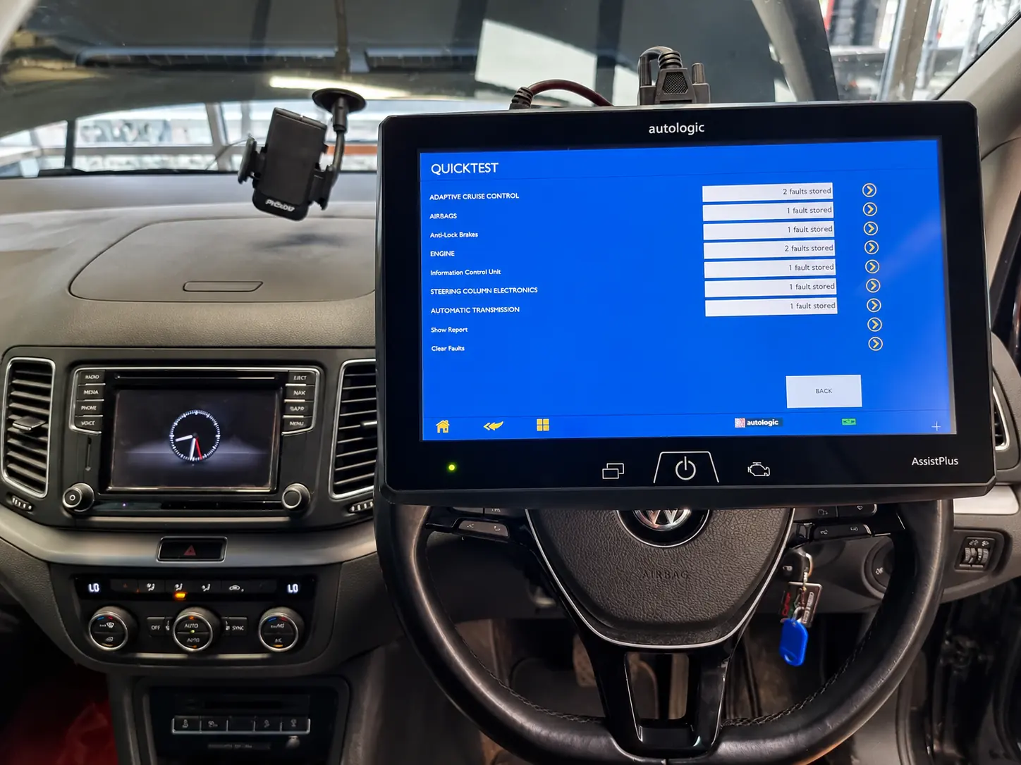 Diagnostic tablet connected to a car during a noise investigation at Cedar Garage